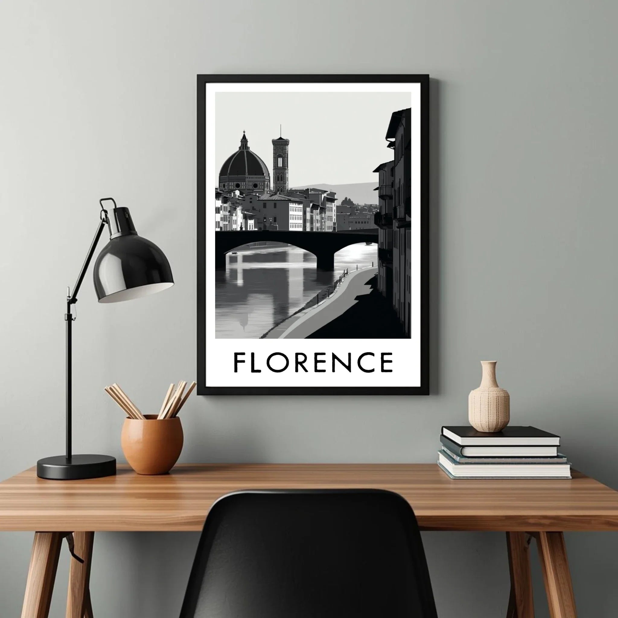 Framed artwork of Florence with a desk and lamp in the foreground