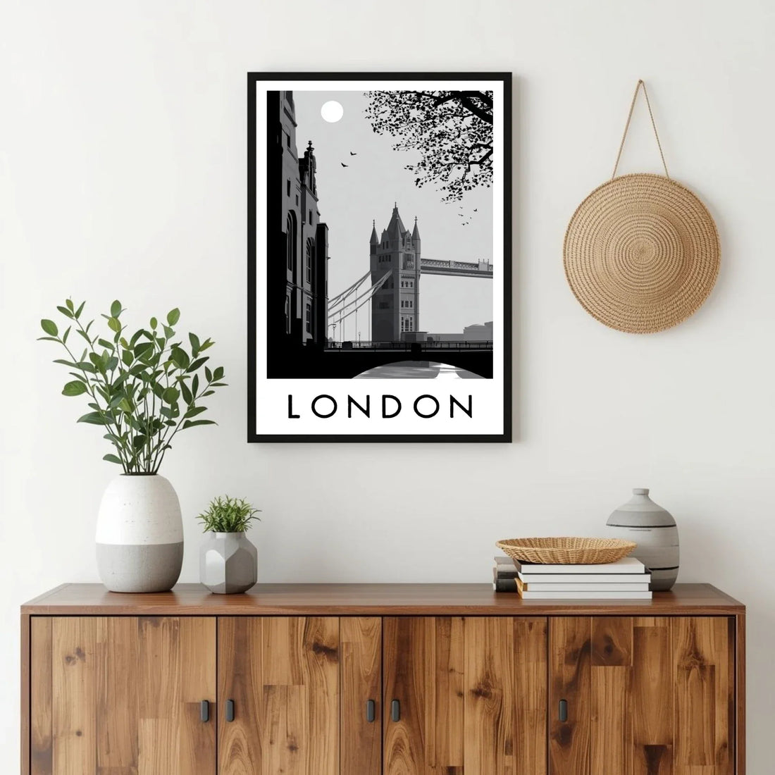 Framed artwork of London with a wooden cabinet and decorative items.