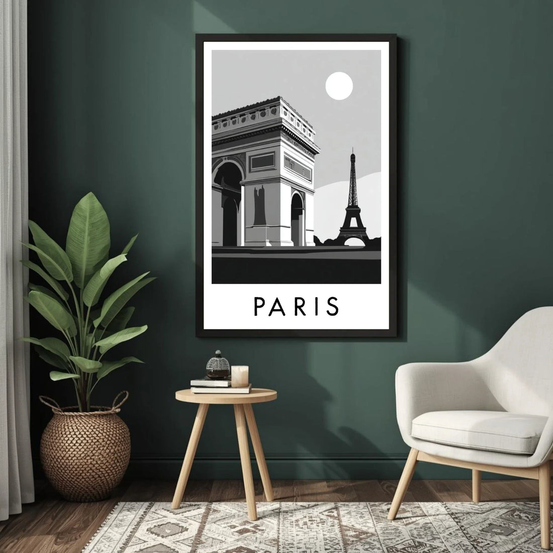 Framed black and white Paris poster on a green wall with a chair and plant in the foreground.