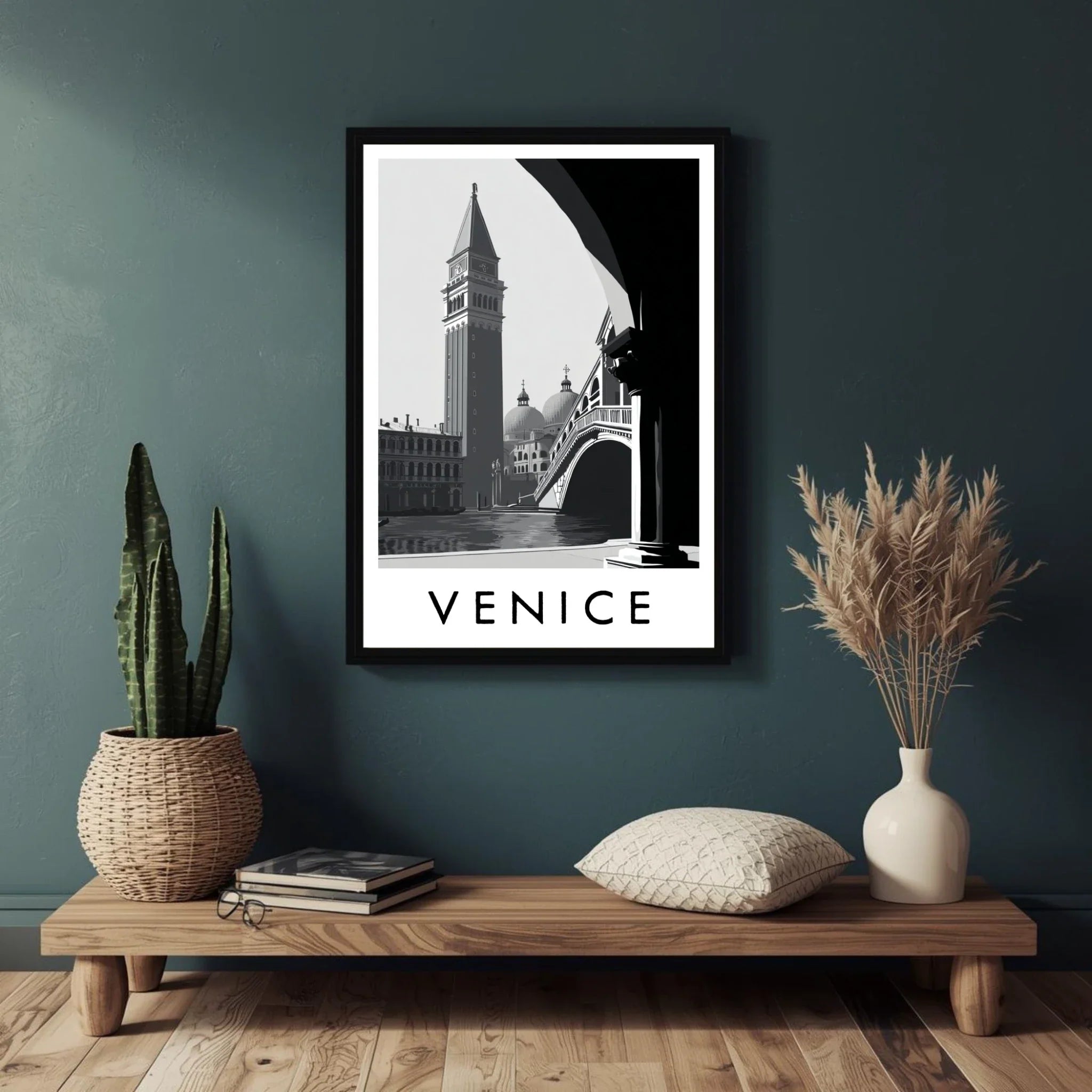 Framed Venice print on a wall above a wooden shelf with decorative items.