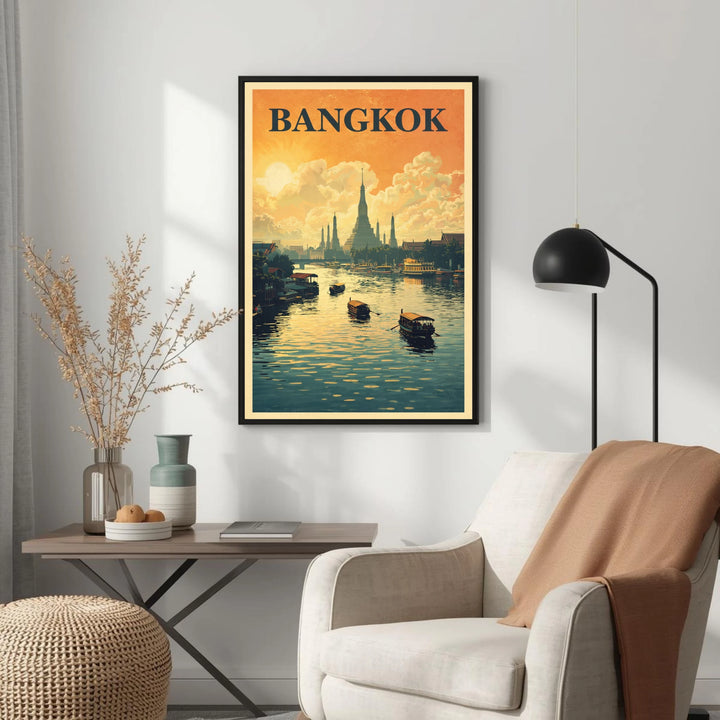 Framed poster of Bangkok on a wall above a white armchair with a lamp and small table.