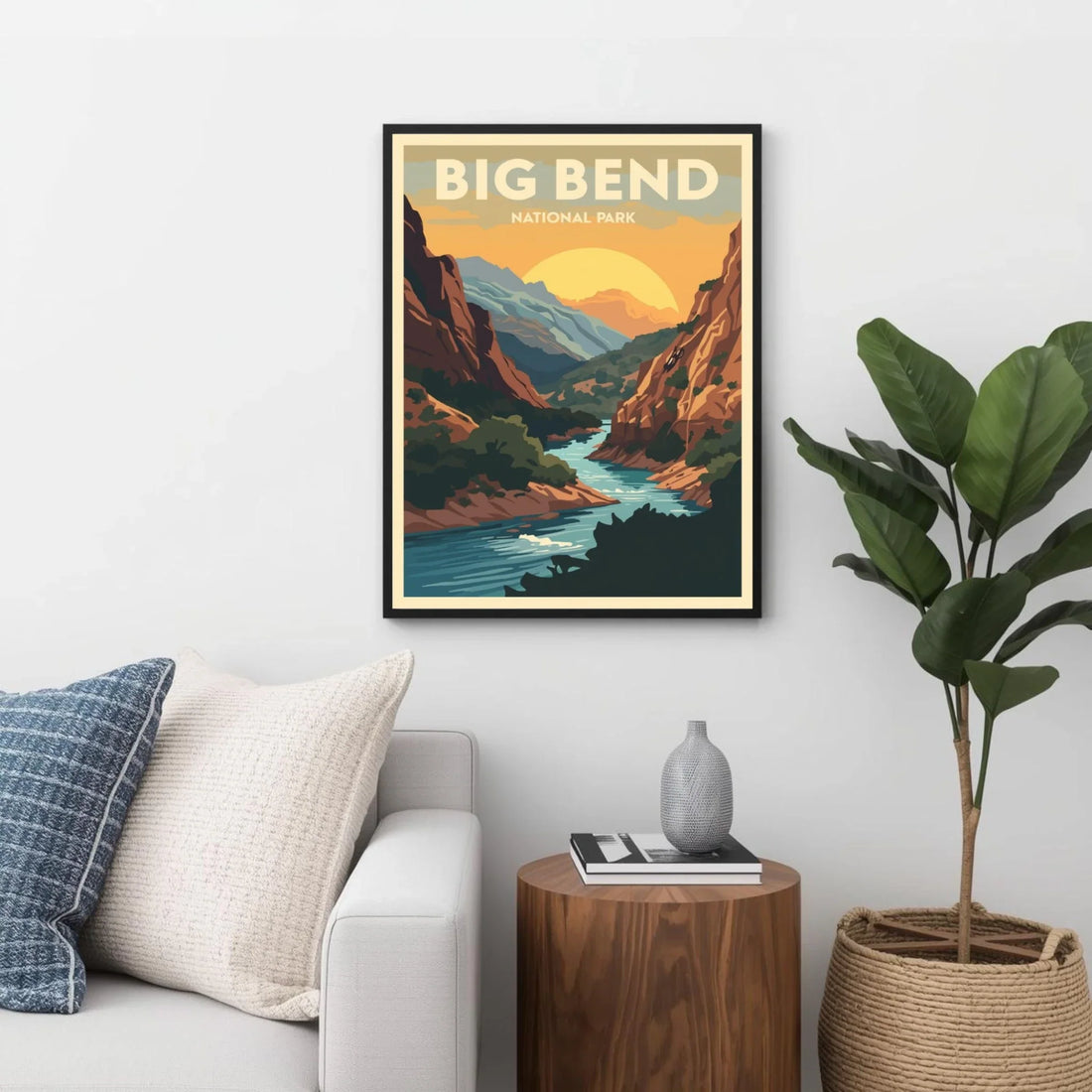 Framed poster of Big Bend National Park in a living room setting with a couch, plant, and side table.