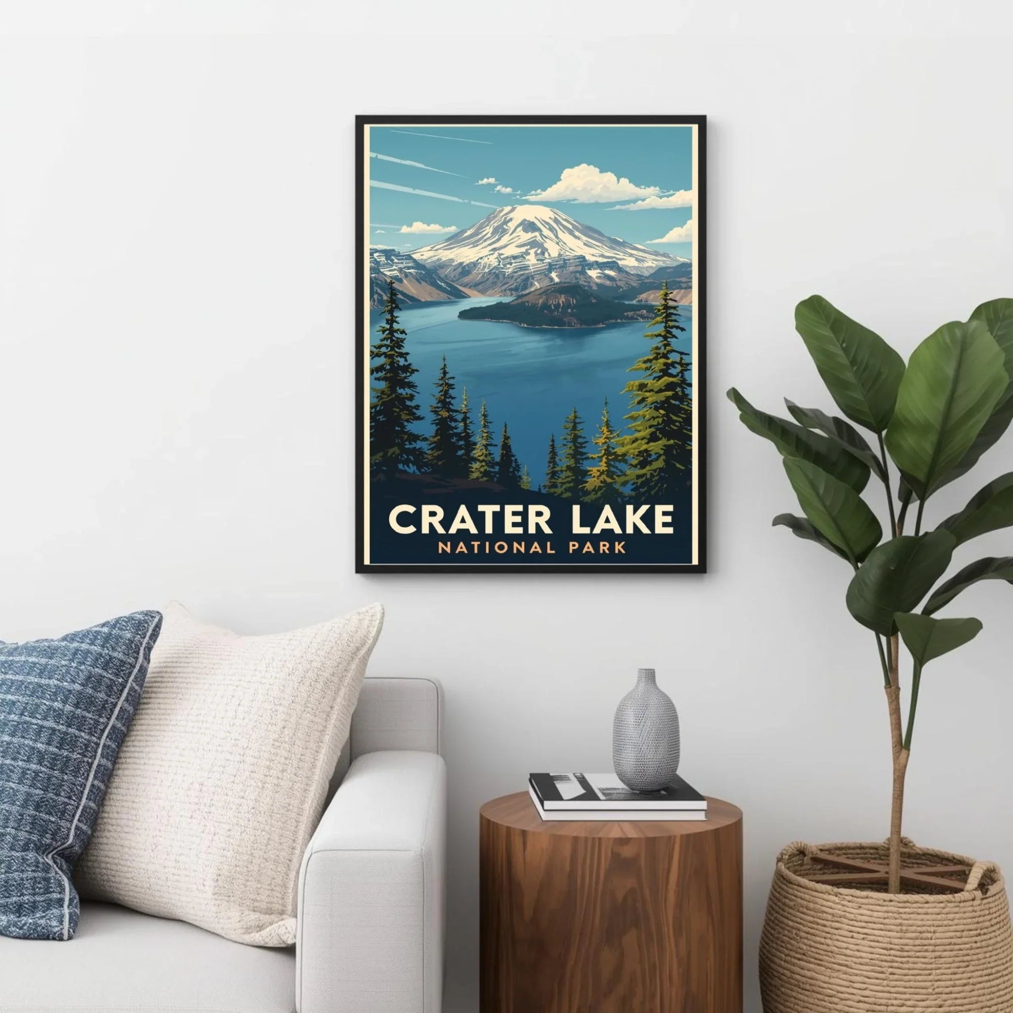 Framed Crater Lake National Park poster on a wall above a sofa.