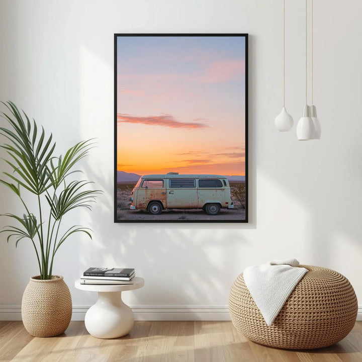 Framed artwork of a van at sunset in a modern interior setting with decor elements.