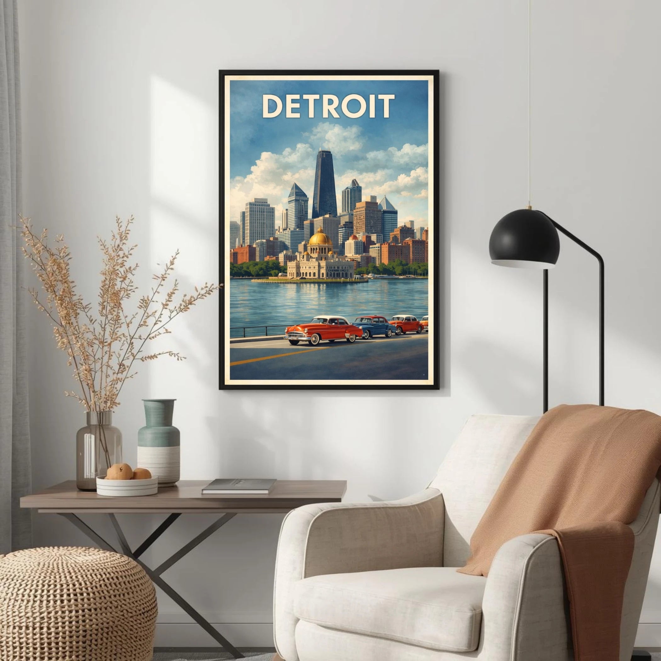 Framed poster of Detroit on a wall above a chair and table.