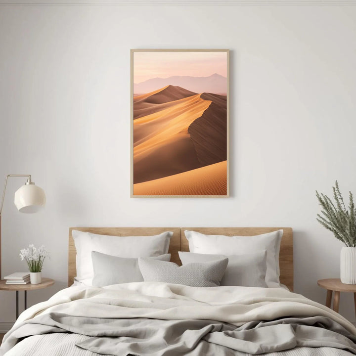 Framed landscape print above a bed in a bedroom