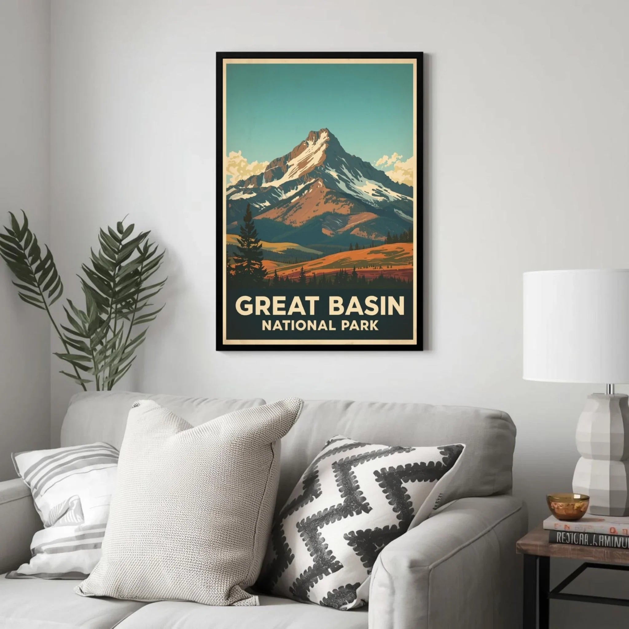 Framed poster of Great Basin National Park above a sofa in a living room.