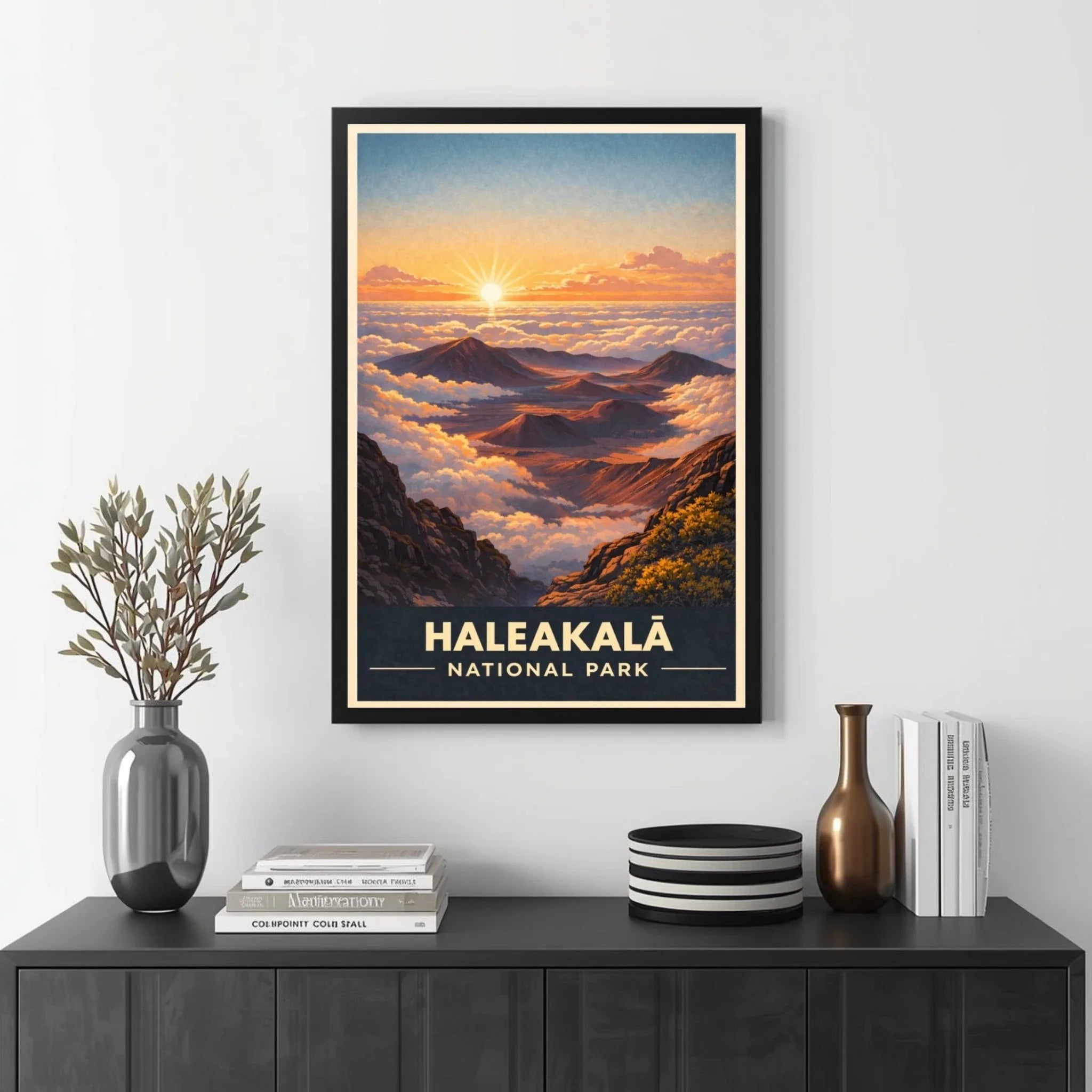 Framed poster of Haleakalá National Park with a mountain landscape, displayed on a wall above a black cabinet.