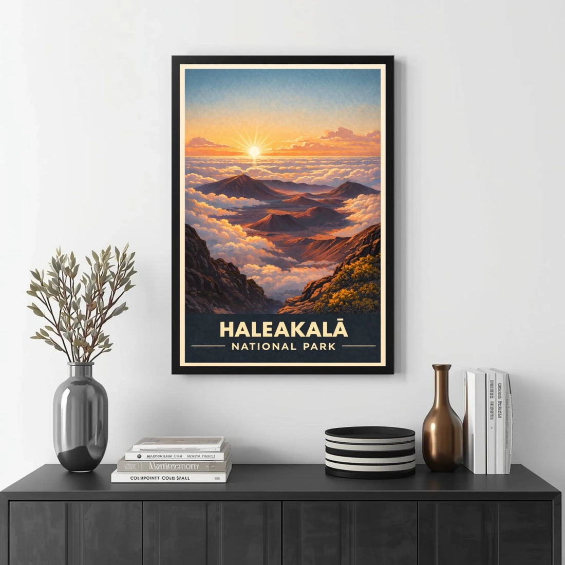 Framed poster of Haleakalá National Park with a mountain landscape, displayed on a wall above a black cabinet.