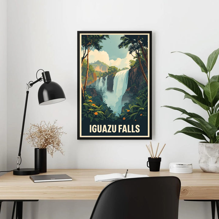 Poster of Iguazu Falls on a wall above a desk with a lamp and plant.
