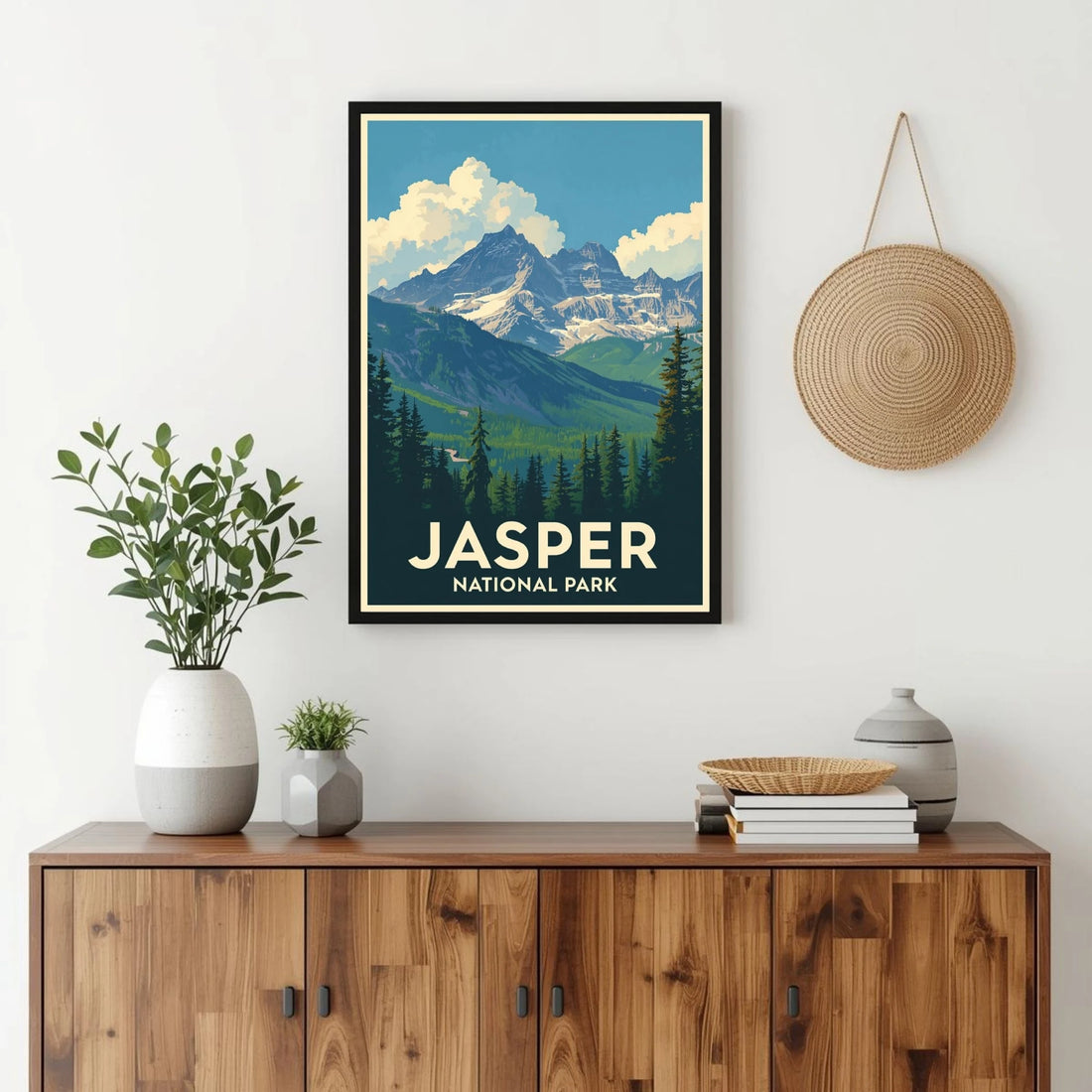 Framed poster of Jasper National Park above a wooden cabinet with decorative items.