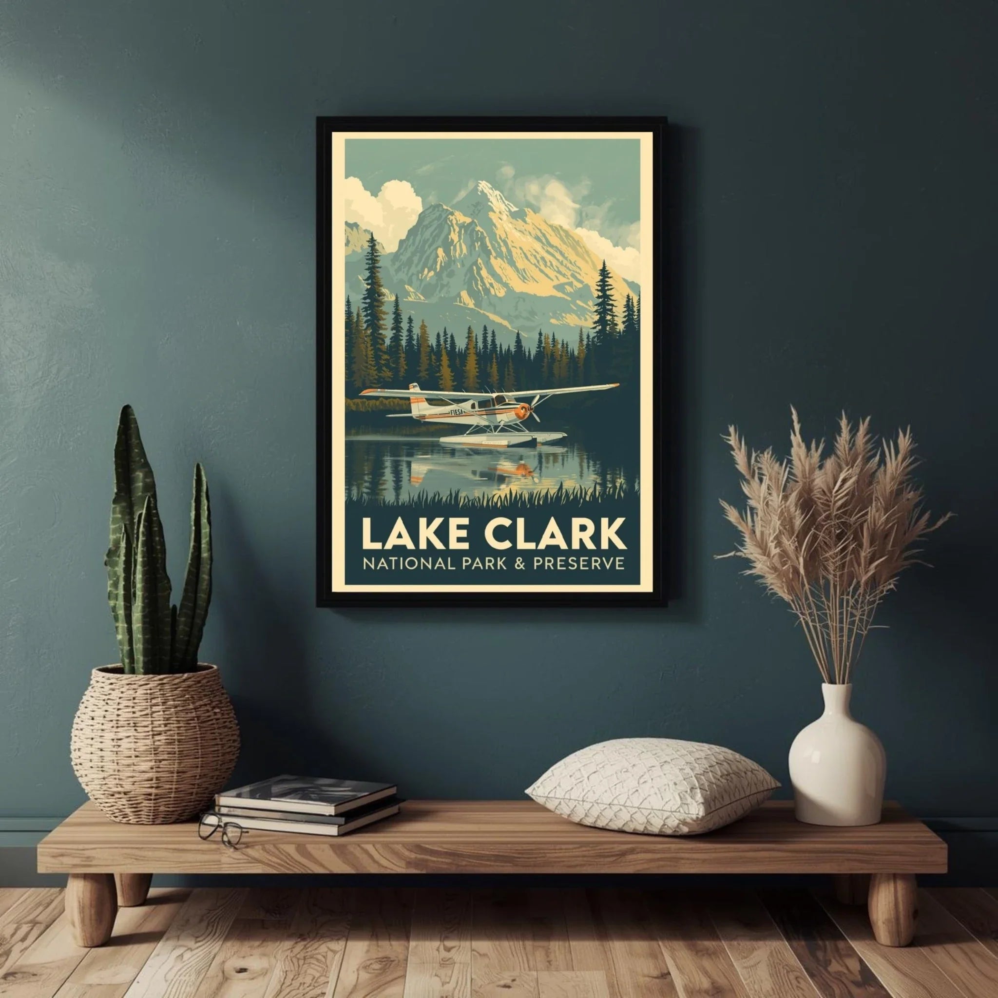 Framed poster of Lake Clark National Park and Preserve on a wall above a wooden shelf with decor items.