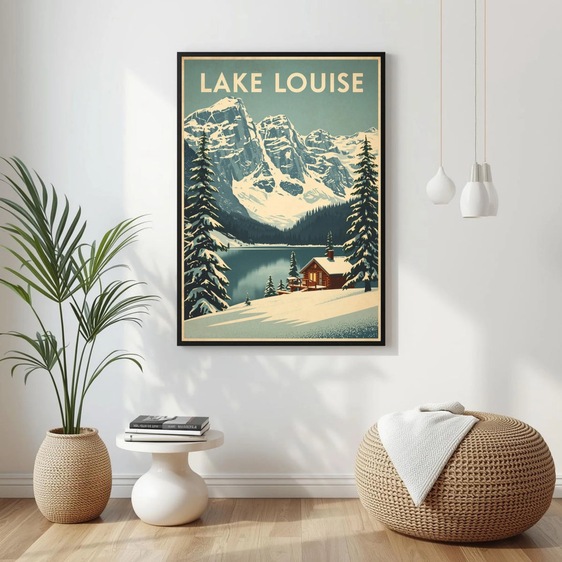 Framed poster of Lake Louise with a plant, table, and ottoman in the foreground.