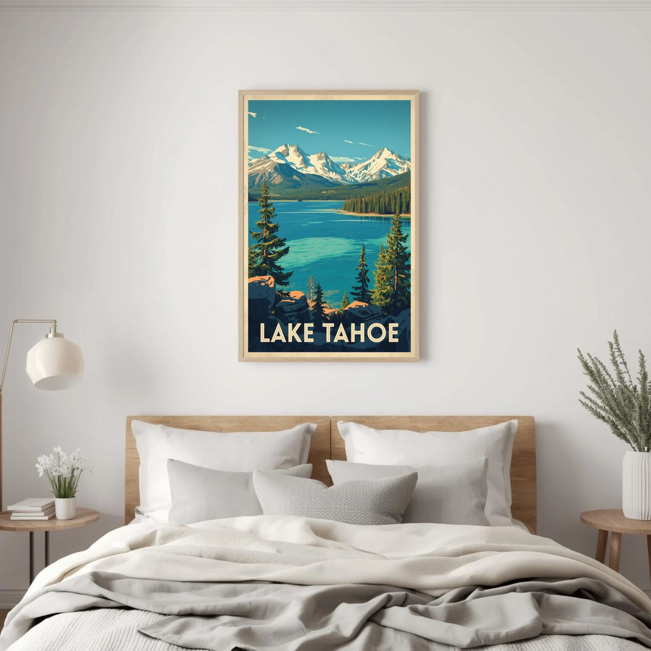Framed artwork of Lake Tahoe above a bed in a bedroom.