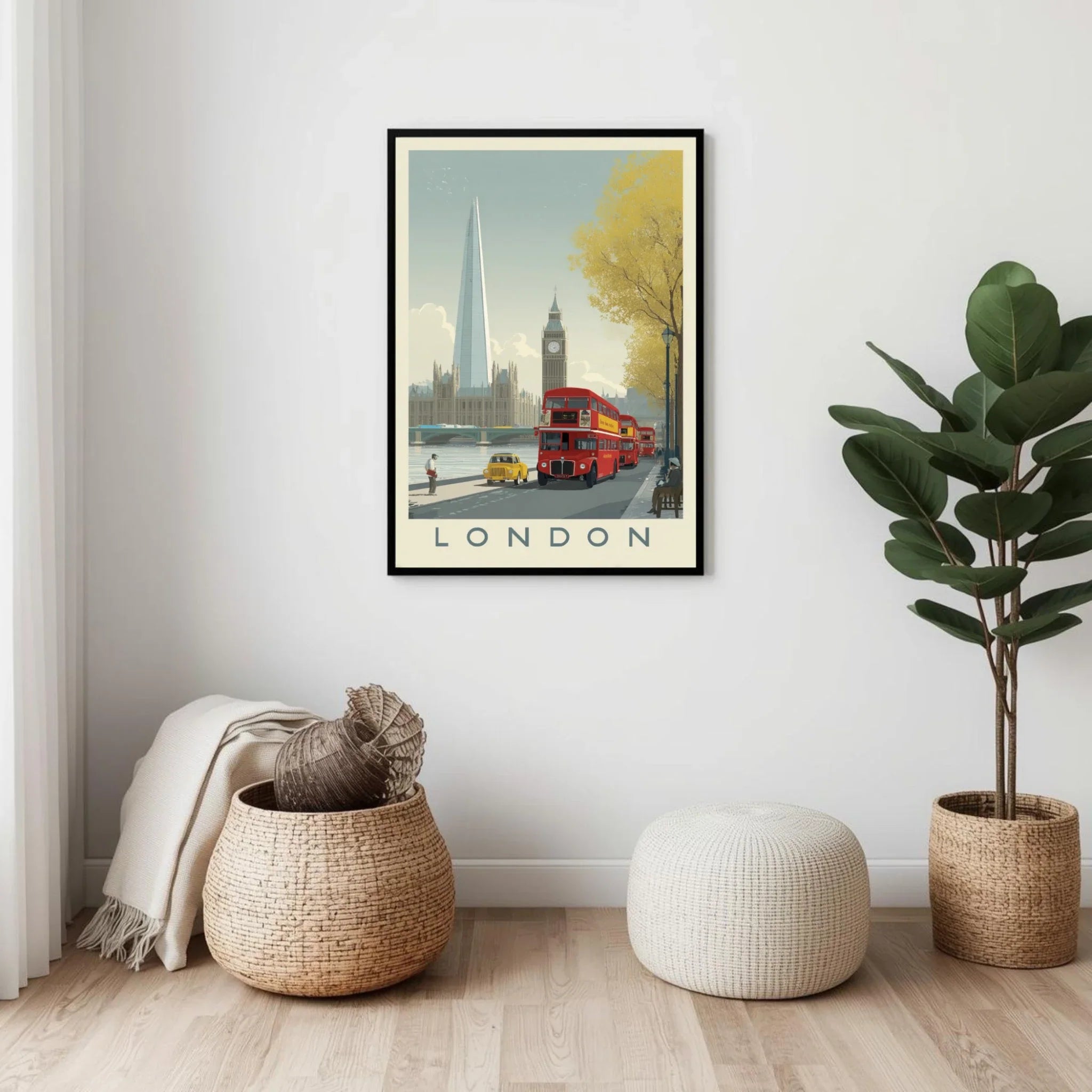 Framed artwork of London with a double-decker bus and Big Ben, placed on a wall above a small table.