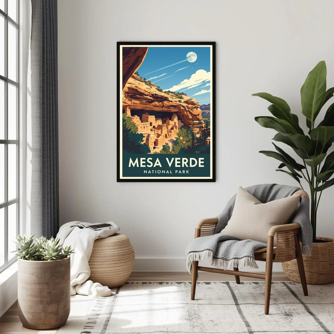 Framed poster of Mesa Verde National Park in a living room setting with a chair and plants.