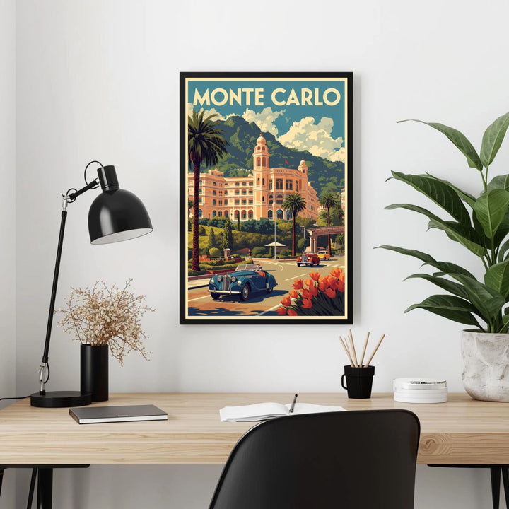 Framed Monte Carlo poster on a wall above a desk with a lamp and plants.