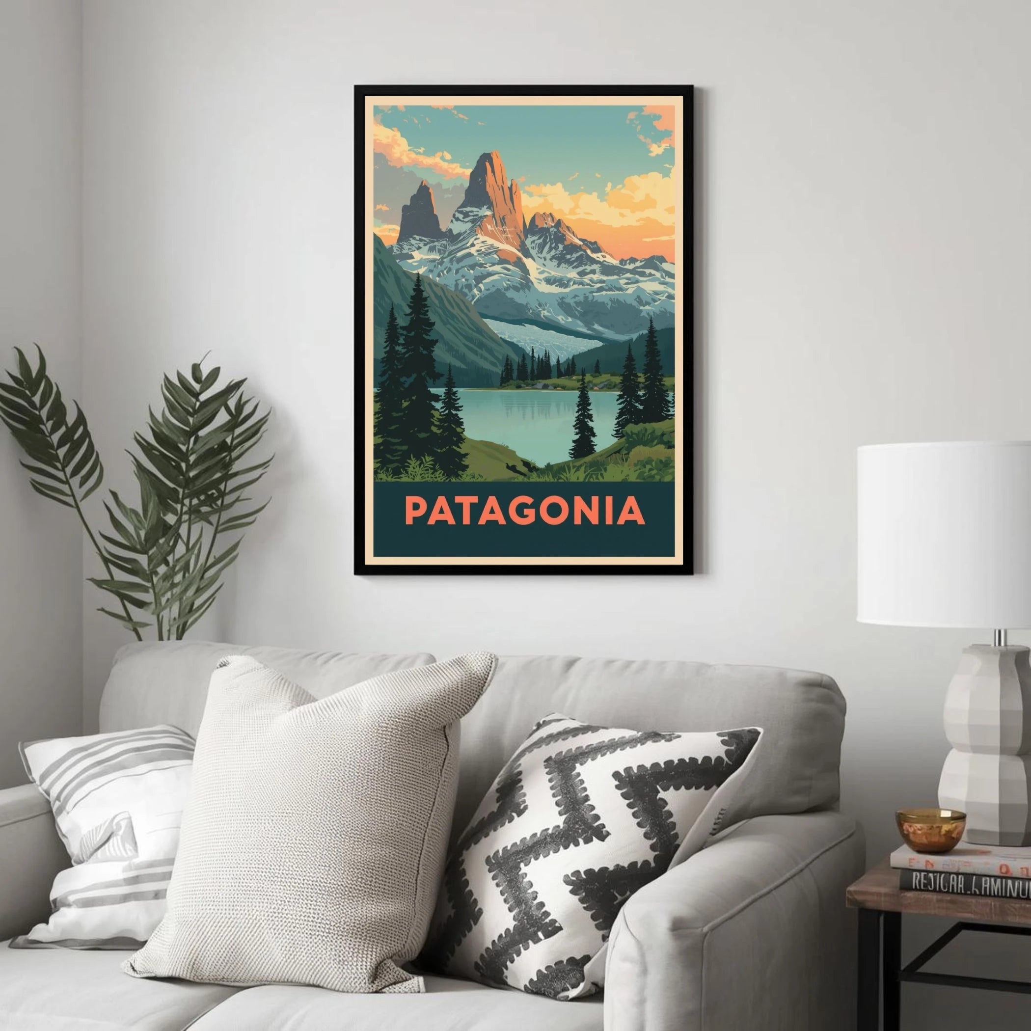 Framed poster of Patagonia on a wall above a sofa with decorative pillows.