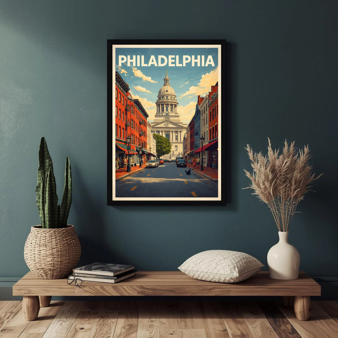 Framed poster of Philadelphia on a wall above a wooden shelf with decorative items.