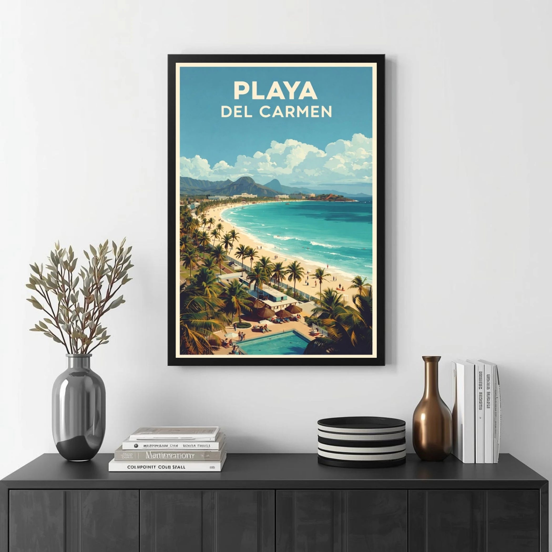 Framed artwork of Playa Del Carmen with a beach scene on a wall above a black console table.