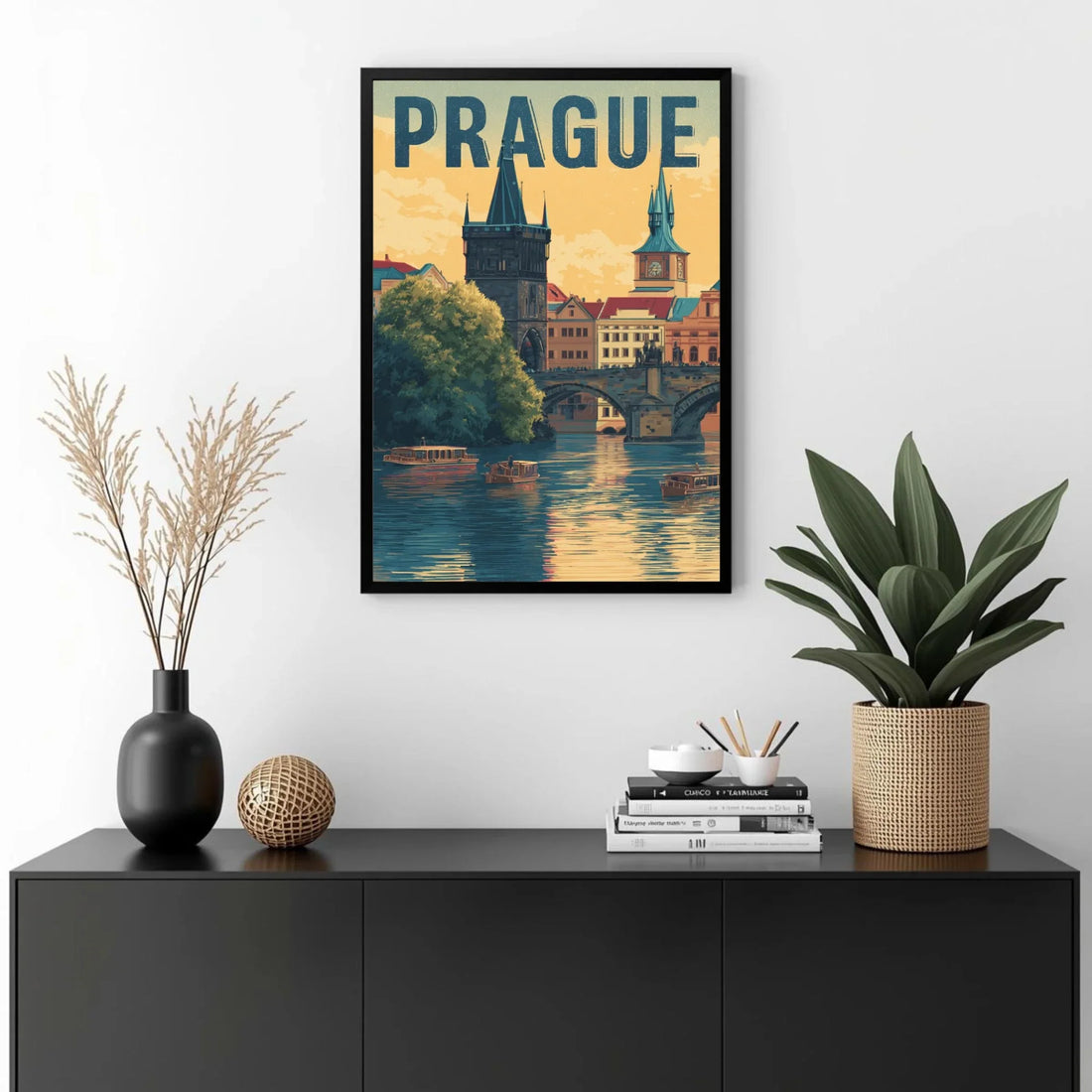 Framed poster of Prague with decorative items on a black cabinet.