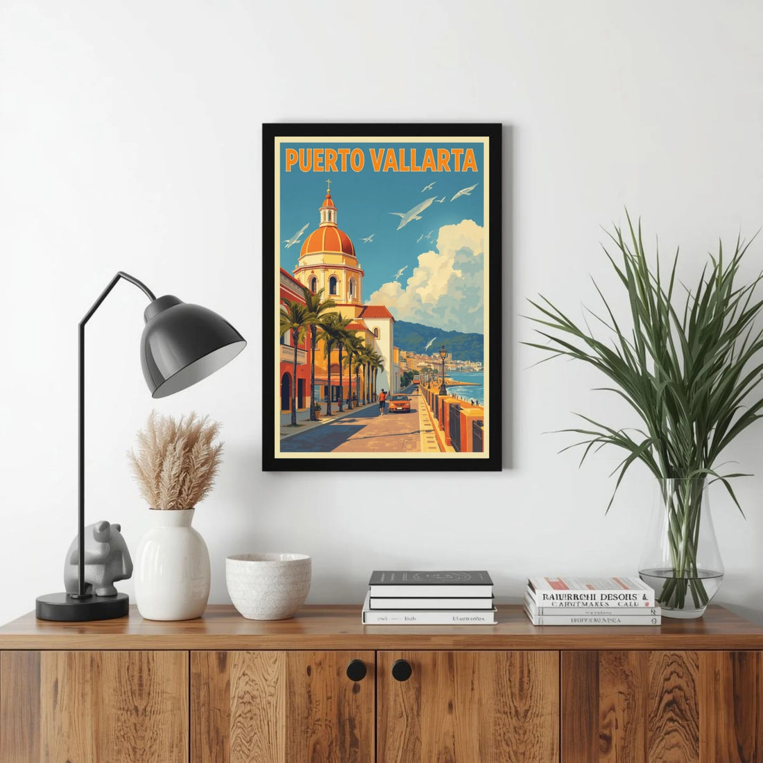 Framed Puerto Vallarta poster on a wall above a wooden console table with decor items.