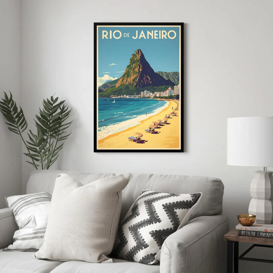 Framed Rio de Janeiro poster on a wall above a sofa with decorative pillows.