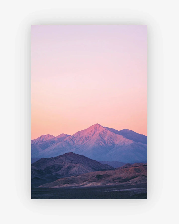 Mountain landscape with a pink and purple sky
