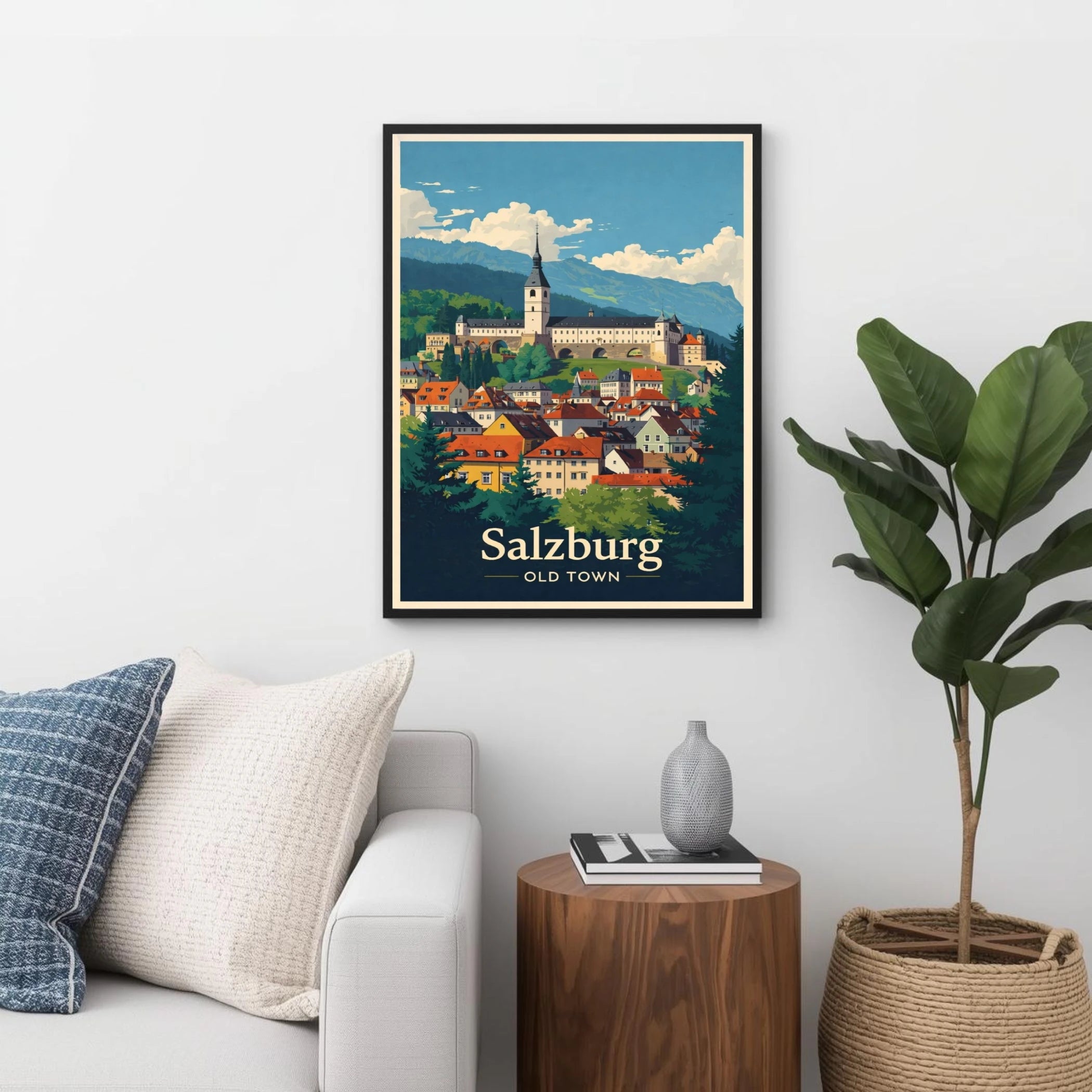 Framed poster of Salzburg Old Town in a living room setting with a couch, plant, and side table.