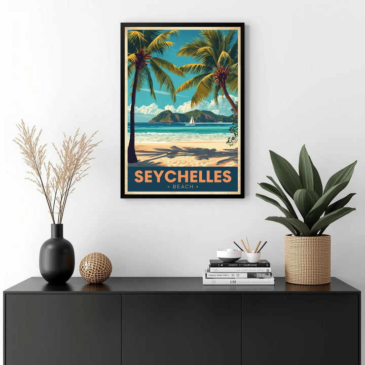 Framed artwork of Seychelles beach on a wall above a black console table with decorative items.