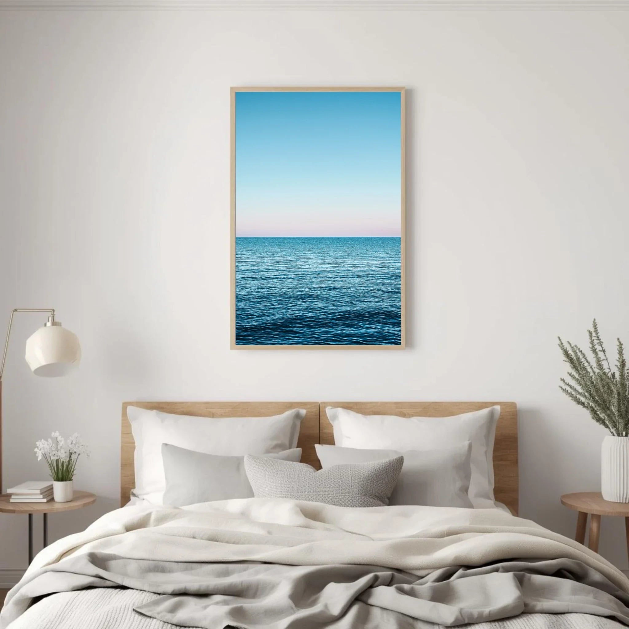 Bedroom with a large framed picture of an ocean view above the bed.