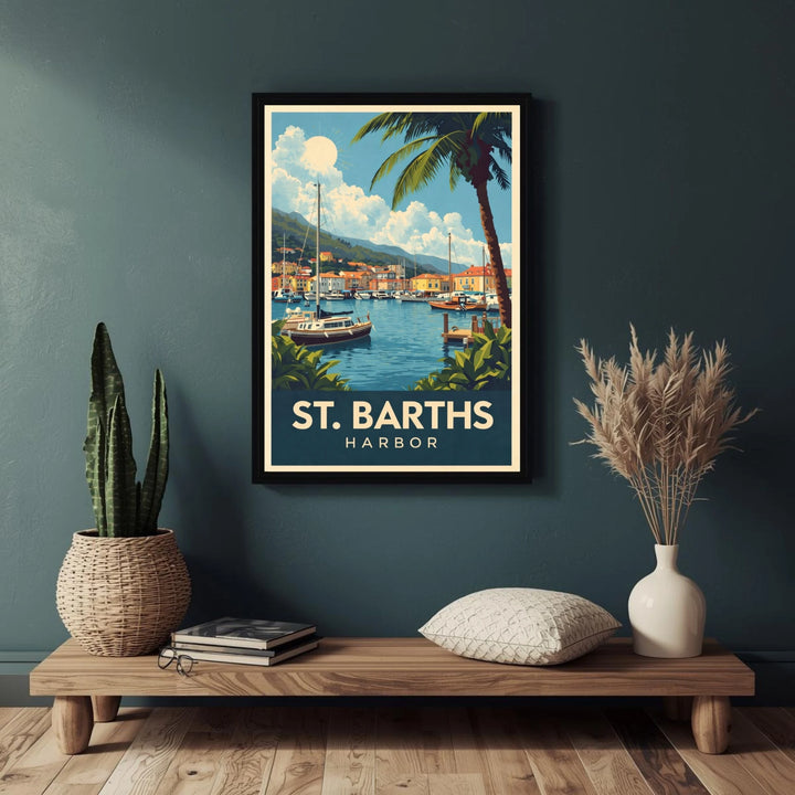 Framed poster of St. Barths Harbor on a wall above a wooden shelf with decorative items.