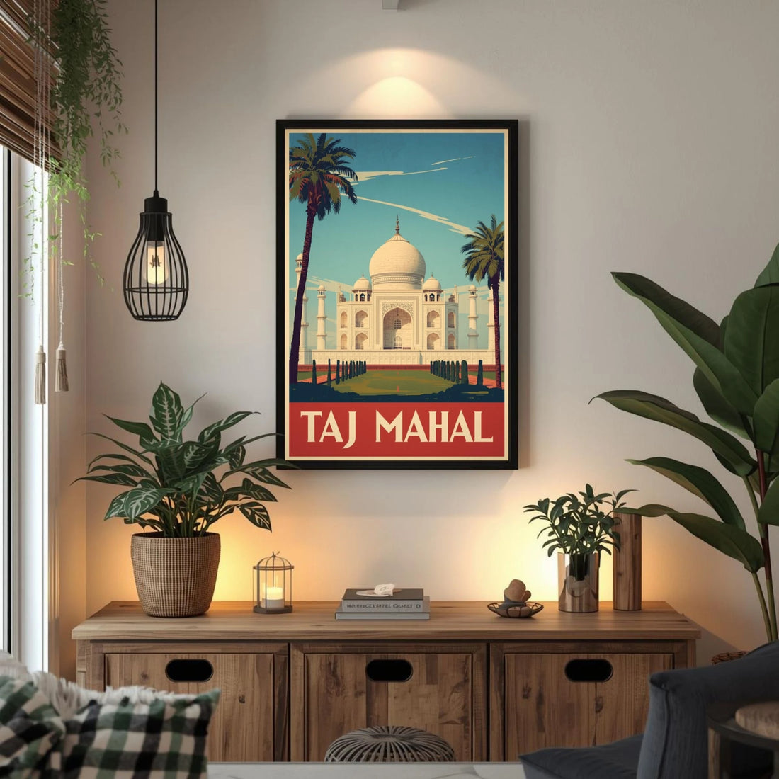Framed poster of the Taj Mahal in a living room with plants and a wooden cabinet.