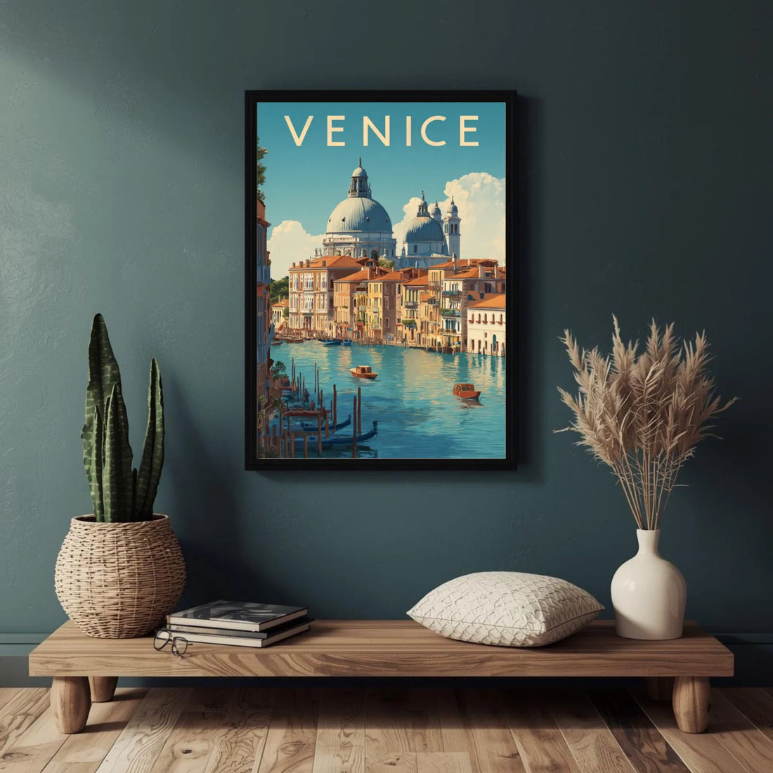 Framed Venice artwork on a wall above a wooden console table with decorative items.
