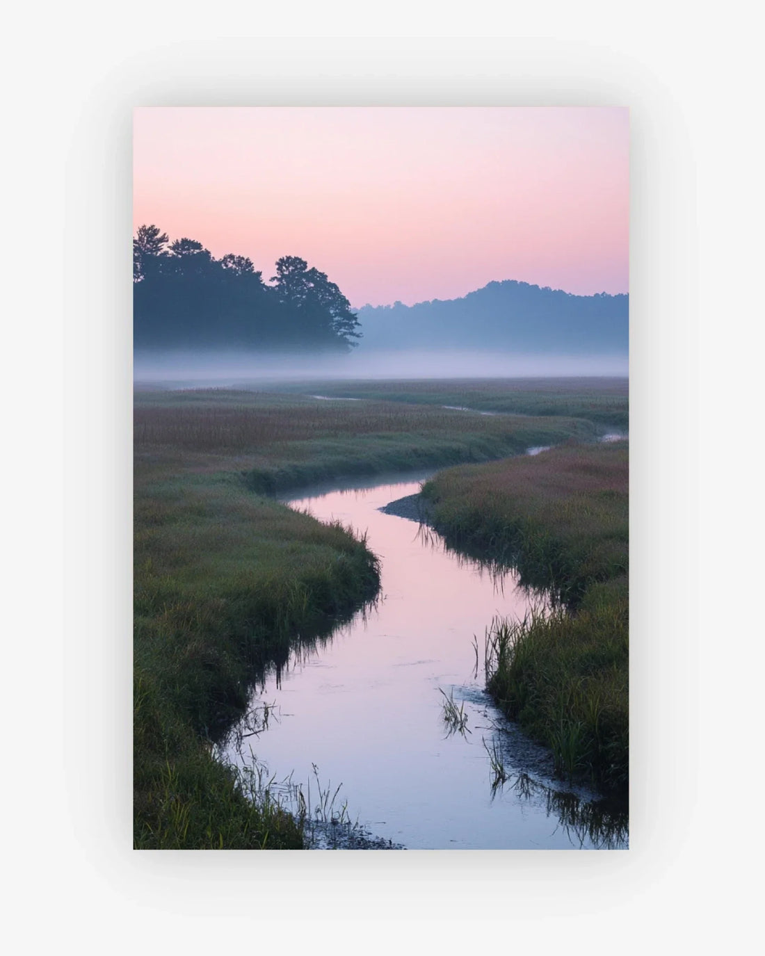 Stream meandering through a grassy field with a pink and purple sky