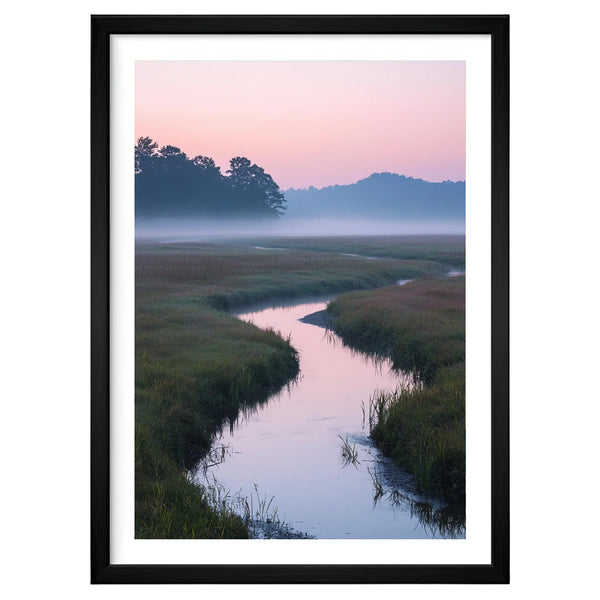 Winding Light landscape artwork in a black frame leaning against an off-white wall, featuring a quiet river winding through a misty meadow beneath a soft pastel dawn sky.